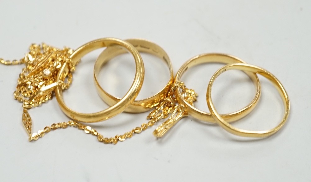 Four assorted 22ct gold wedding bands, including Birmingham, 1913, size P/Q and a 22k fine link chain, 46cm, gross 13.1 grams.